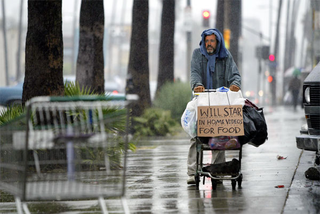 Mel Gibson begs for work on Wilshire Boulevard in Los Angeles.